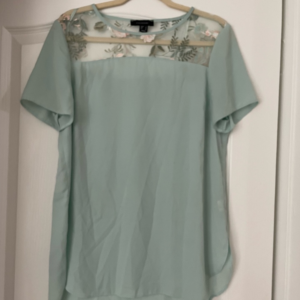 Turquoise blouse with light pink flowers